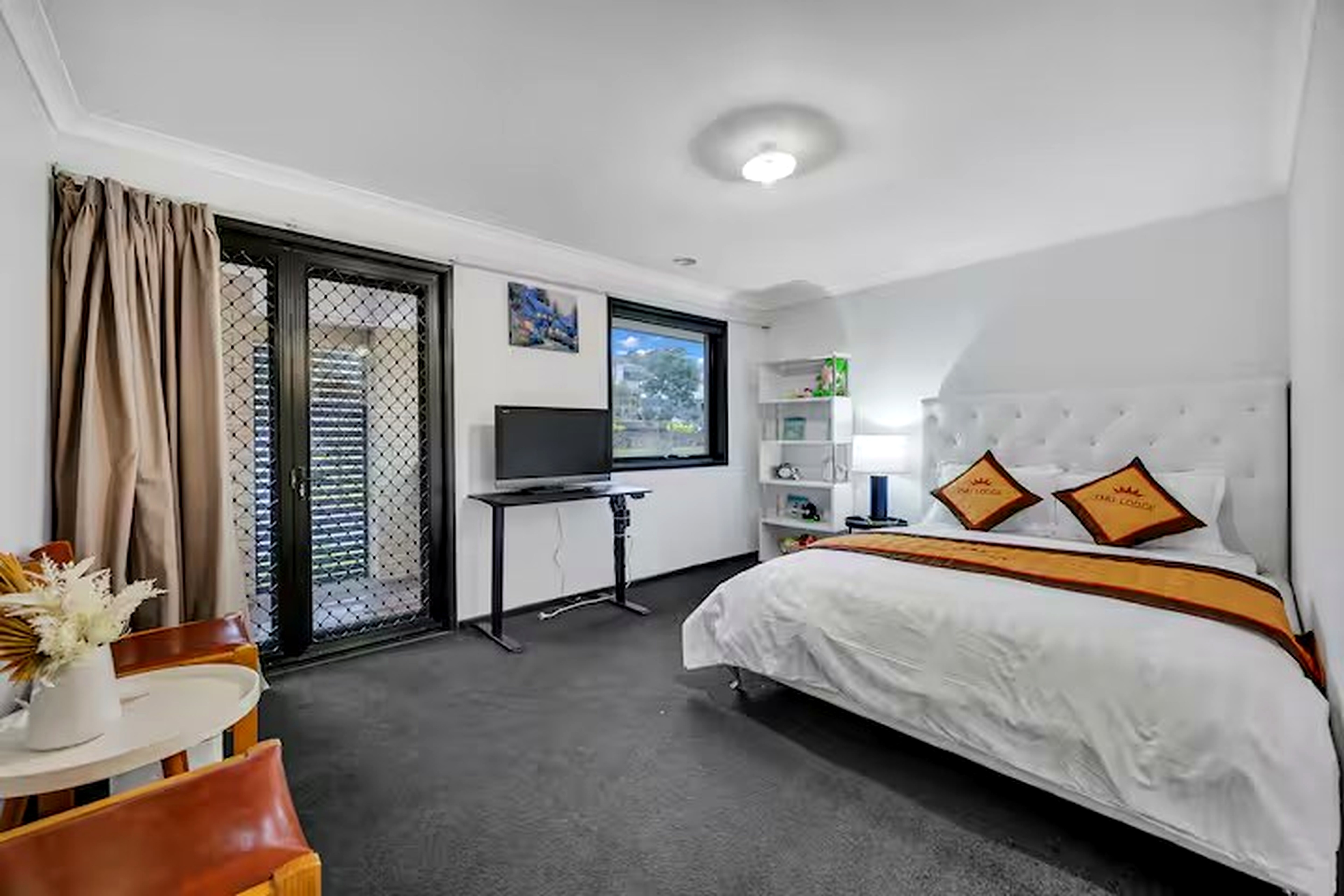 Belleview main house bedroom with TV